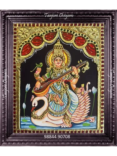 Traditional Goddess Saraswathi Tanjore painting with veena and swan, handcrafted using gold foil and embossed detailing